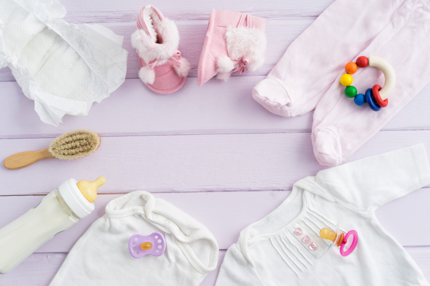 Collection of items for babies shot from above. Ideal website hero or header image