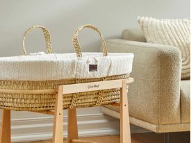 A baby cot in a room